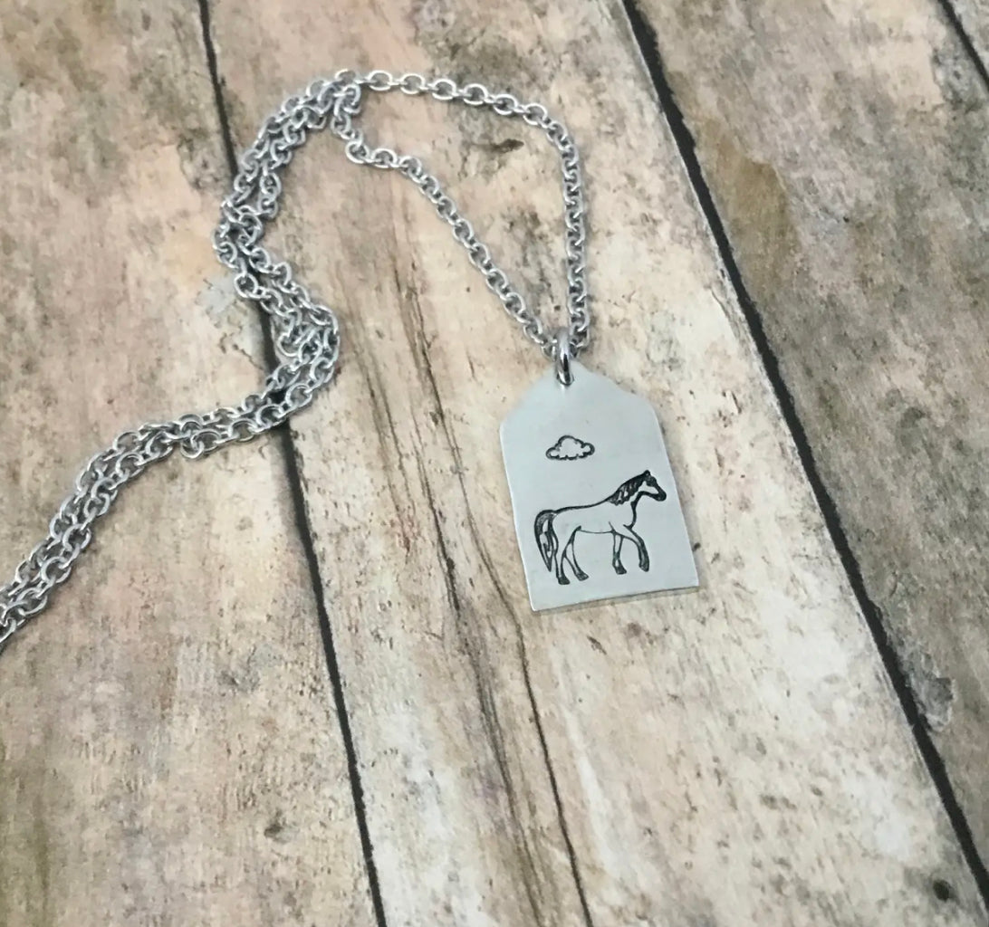 Horse on cloudy day, cattle ear tag style pendant